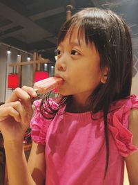 Close-up of girl blowing bubbles