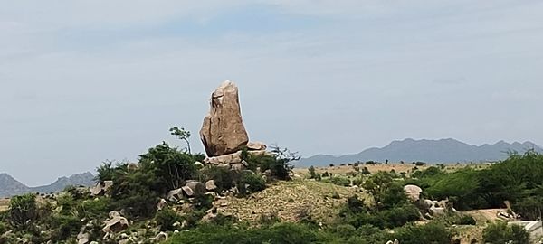 Rocks on mountain against sky