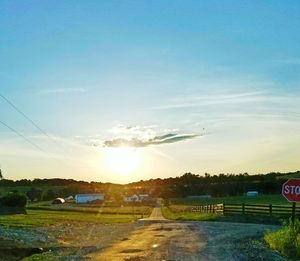 View of golf course against sky during sunset