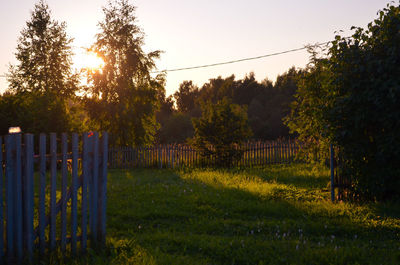 Fence on field against sky