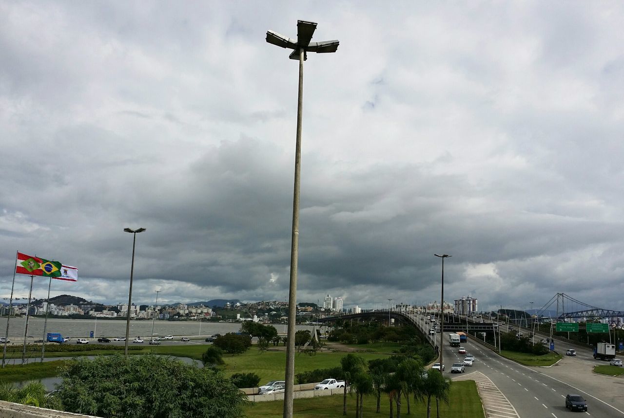 VIEW OF ROAD AGAINST CLOUDY SKY