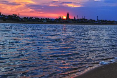 Scenic view of sea against sky at sunset