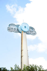 Low angle view of windmill against sky