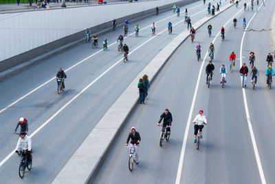 High angle view of people riding bicycles on road