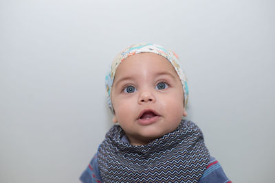 Cute baby boy against white background