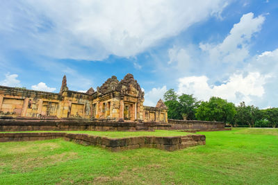 Historic building against cloudy sky