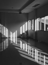 Man sitting on staircase in building