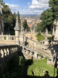 Panoramic view of trees and buildings against sky