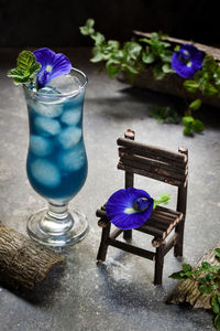 Close-up of purple flower on table