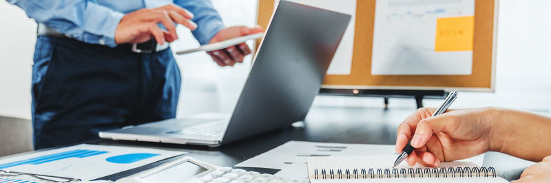 Low angle view of man working on table