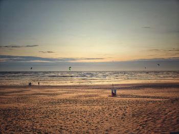 Scenic view of beach against sky during sunset