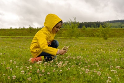 Side view of child on field