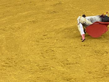 Rear view of man on field