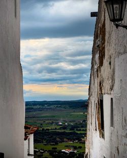 View of town against cloudy sky