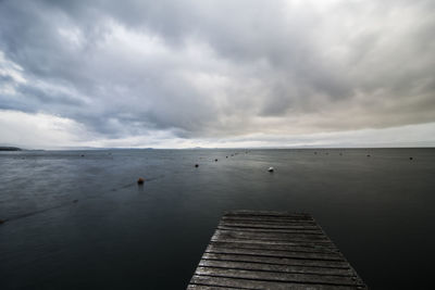 Pier over sea against sky