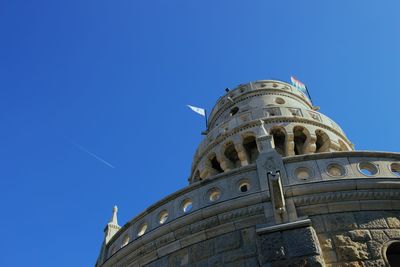 Low angle view of building against blue sky