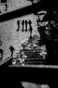 High angle view of people walking on street