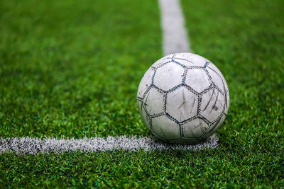 Close-up of soccer ball on field