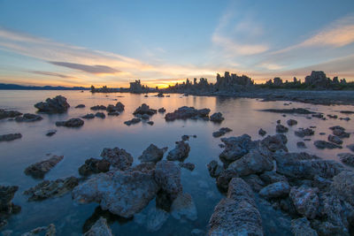 Scenic view of sea against sky at sunset