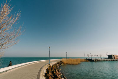 Scenic view of sea against clear blue sky