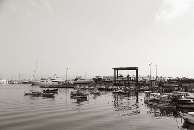 Boats moored at harbor