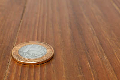 High angle view of coins on table