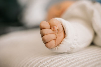 Close up of baby's hand in a fist