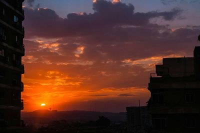 Scenic view of dramatic sky at sunset