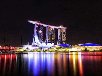 Illuminated ferris wheel at night