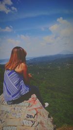 Scenic view of landscape against cloudy sky