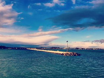 Scenic view of sea against sky at sunset