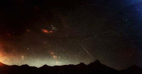 Scenic view of mountains at night