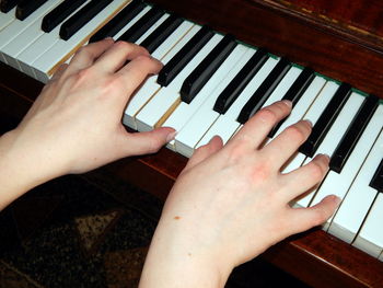 Cropped image of man playing piano