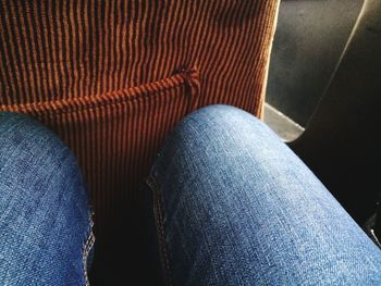 Low section of person sitting on floor