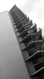 Low angle view of staircase by building against sky