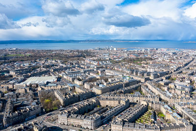 Aerial view of cityscape against sky