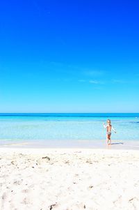 Scenic view of sea against clear blue sky