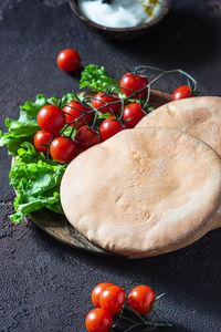 Traditional middle eastern lebanese cream cheese dip with olive oil and herbs served with pita.