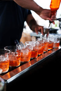 Midsection of man preparing food on table