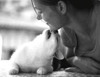 Midsection of woman with cat