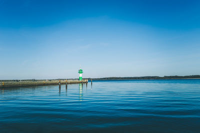 Scenic view of sea against blue sky