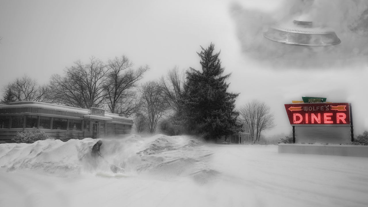 VIEW OF TEXT ON SNOW COVERED ROAD