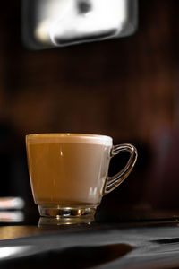 Close-up of coffee cup on table