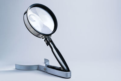 Close-up of electric lamp against white background