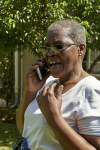 Senior woman talking on the phone outdoors