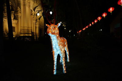 Illuminated sculpture at night