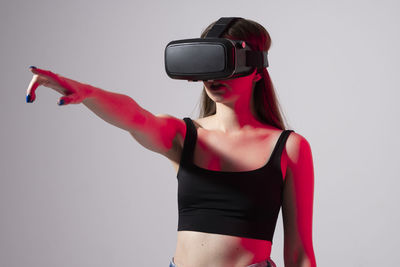 Happy young woman playing on vr glasses. 