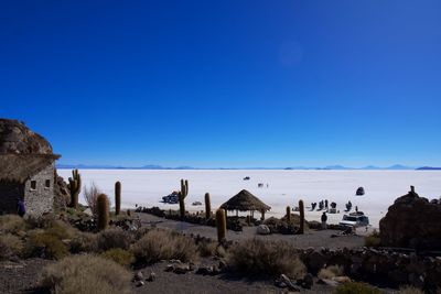 Scenic view of sea against clear blue sky