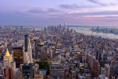 Aerial view of city buildings during sunset