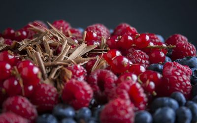 Close-up of raspberries against black background